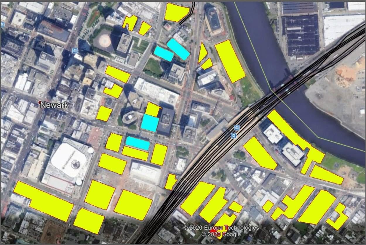 Satellite image of Newark, NJ, with areas dedicated to surface parking highlighted