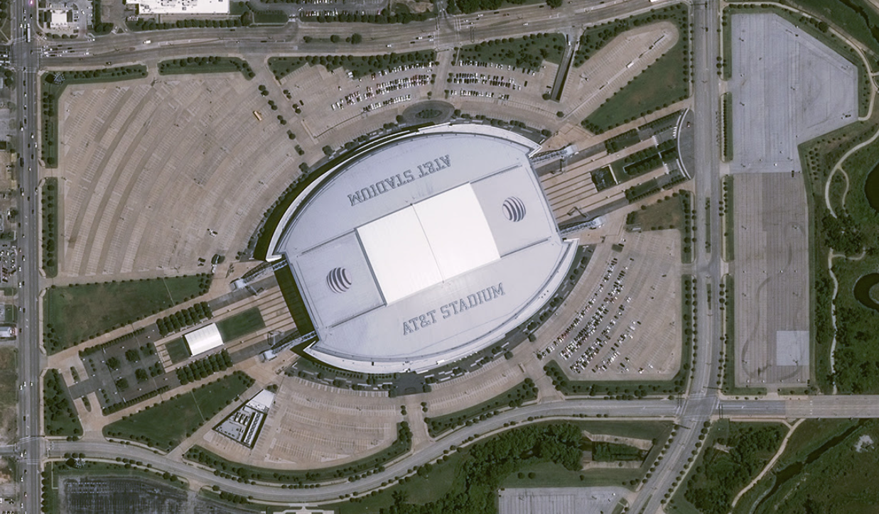 Satellite picture of AT&T Stadium, Arlington, surrounded by parking 2-3x the sqft of the structure