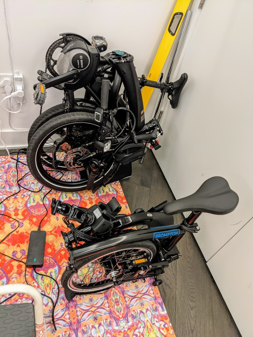 Tern Vektron Q9 folded next to Brompton Electric